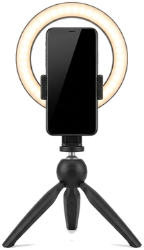 a phone on a tripod with a ring light